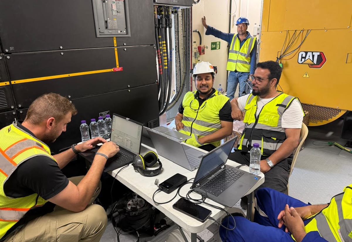 Engineers running a generator load test